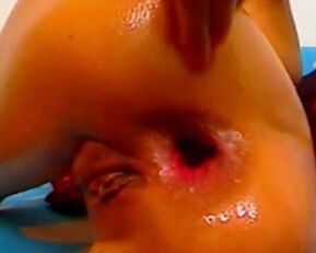 Watch this wild cam girl take on three massive dildos in her ass for the ultimate anal experience!