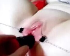 Watch as this amateur gets her clamped pussy filled with toys and dildos