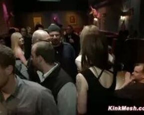 Watch this blonde babe get suspended and face drilled in kinky doggy bar group sex