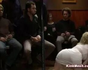 Watch this blonde babe get suspended and face drilled in kinky doggy bar group sex