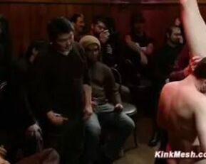 Watch this blonde babe get suspended and face drilled in kinky doggy bar group sex